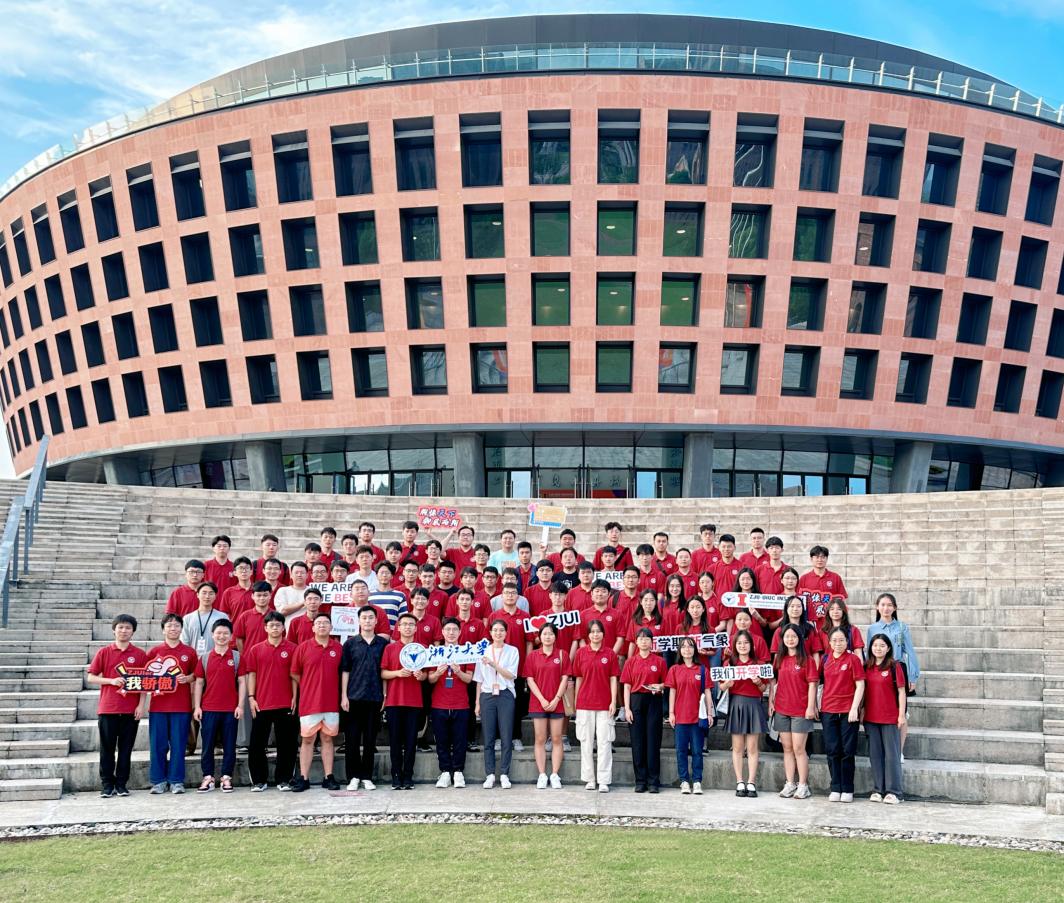 Group photo of students on the steps of the building